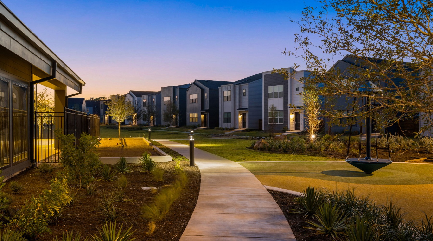 row of homes along an amenity lawn for residents 