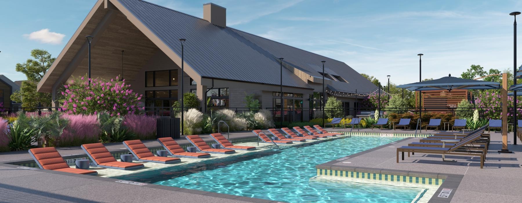 a swimming pool with chairs around it in front of a building