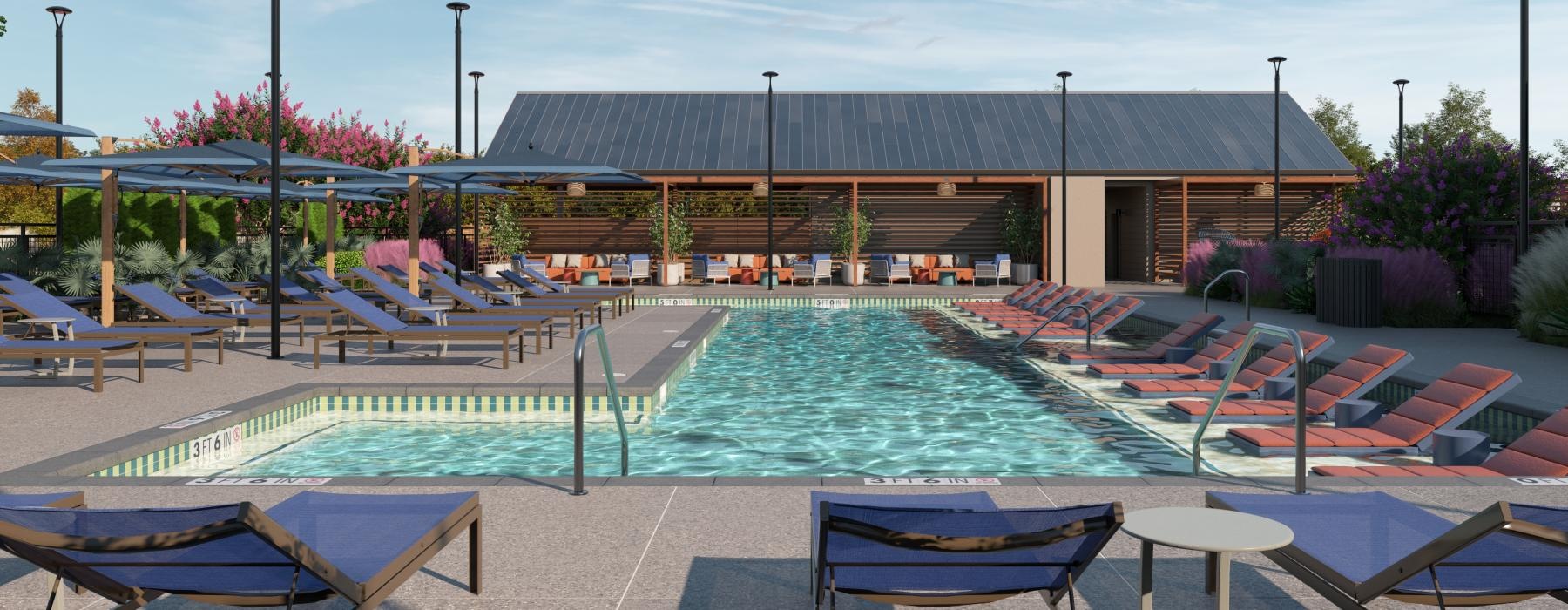 a swimming pool with chairs and a building in the background