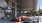 the clubhouse patio with a table chairs and a large glass door