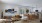 living room and kitchen with large windows and sliding doors