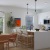 open kitchen with waterfall edge island 