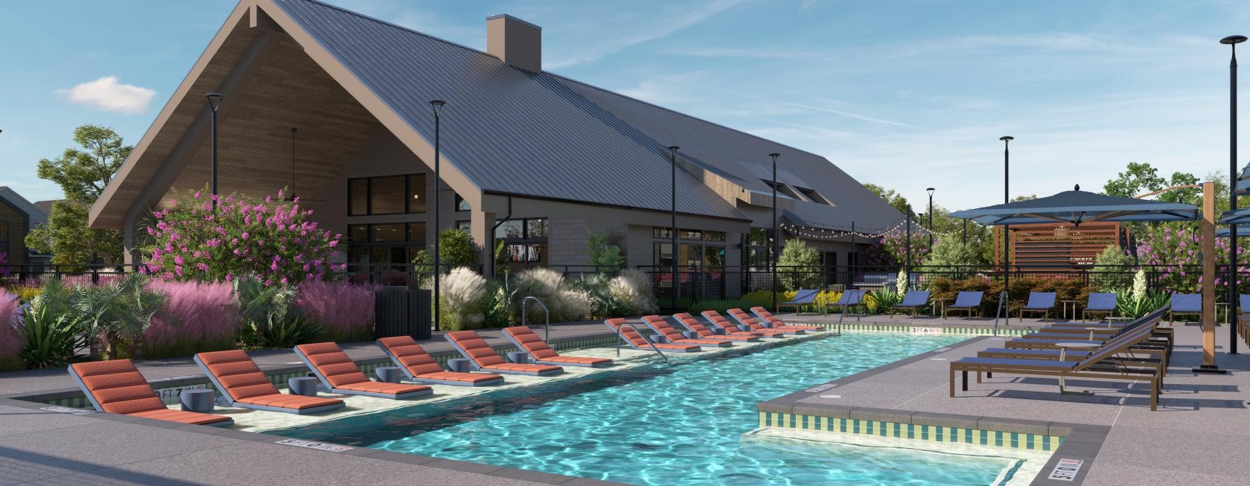 a swimming pool with chairs around it in front of a building